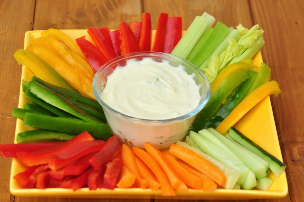 Fresh cut vegetables and dip is a wholesome snack.